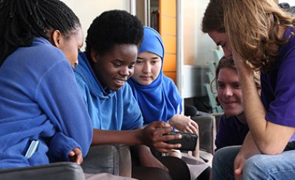 UQ journalism student with Woodridge State High School students. Photo by Daniel Seed